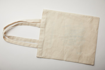 top view of cotton bag on white surface, minimalistic concept