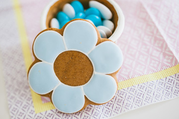 Baptism Christening sweets on delicate napkin with open lid made from dough and marzipan paste containing multiple sweets