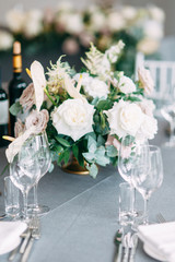 Stylish wedding decor and decoration of the hall. The bride's bouquet and dress, European part. the minimalism and simplicity of the decor