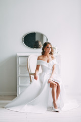 A concept wedding, contemporary European bride. Bouquet of flowers, fees in the interior Studio....