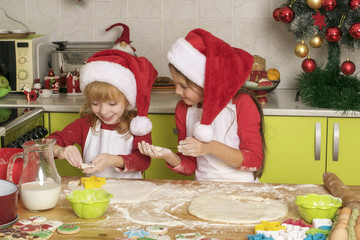 The girls make cookies for Christmas