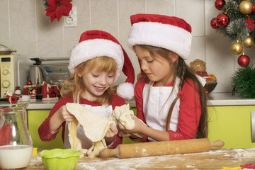 The girls make cookies for Christmas