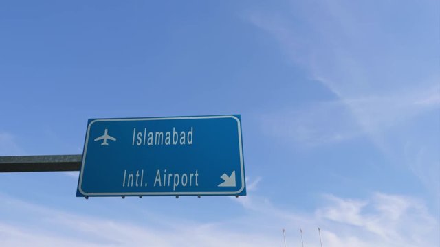islamabad airport sign airplane passing overhead