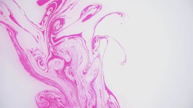 Stains of pink ink on the water. Abstract background footage.