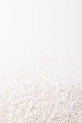 top view of decorative confetti on white background