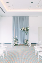 Stylish wedding decor and decoration of the hall. The bride's bouquet and dress, European part. the minimalism and simplicity of the decor