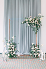 Fototapeta na wymiar Stylish wedding decor and decoration of the hall. The bride's bouquet and dress, European part. the minimalism and simplicity of the decor