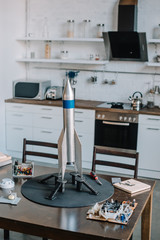 rocket model and tools for designing on table in kitchen