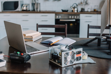 laptop and tools for engineering on tabletop at home