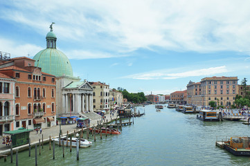 Naklejka premium View from Ponte degli Scalzi towards the Grand Canal with San Simeone Piccolo church on the left with its striking oxidized copper dome facing the railroad terminal