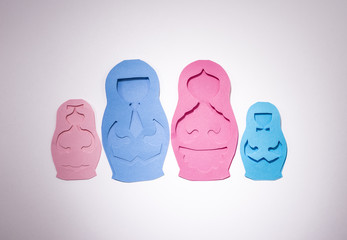 family in the form of matryoshka dolls made of colored paper.