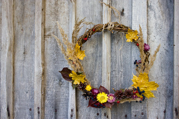autumn halloween wreath on  wooden background