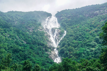 The huge waterfall Dudhsagar and the railway bridge passing through it