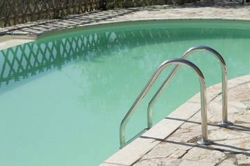 Obraz na płótnie Canvas Isolated pool ladder - Swimming pool details (Marche, Italy, Europe)