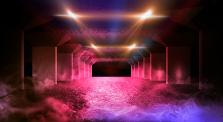 Dark corridor of the underground garage, street exterior, neon light. Abstract dark background of street asphalt with smoke, rays of searchlights in tunnels