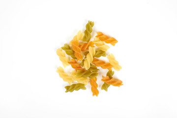 Fototapeta premium Raw colorful italian fusilli pasta isolated on white