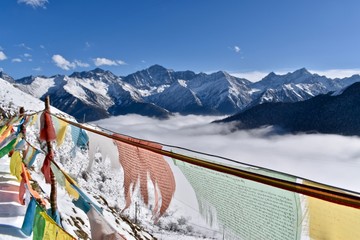 Prayer flags and the sea of clouds at Sichuan, China