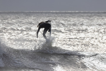 Surfer goes vertical on the ocean