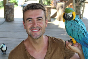 Bird tamer working with a macaw 