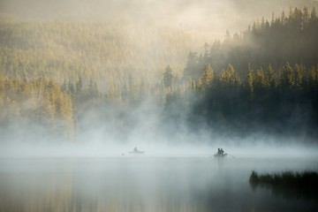 Fishermen on a beautiful misty morning at Mount Hood - 227281222