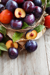 Fresh plums with leaves