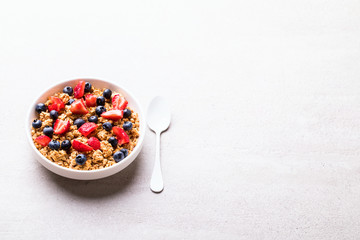 Granola Cereal bar with Strawberries and blueberries  on the Gray Background . Muesli  Breakfast. Healthy Food sweet dessert snack. Diet Nutrition Concept. Vegetarian food.Copy space