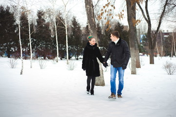 Fototapeta na wymiar couple in love in the winter forest