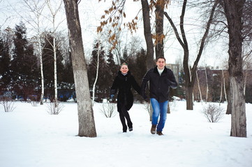 Fototapeta na wymiar couple in love in the winter forest