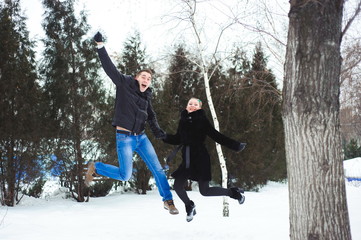 Young couple hugging and kissing in the Park in winter.