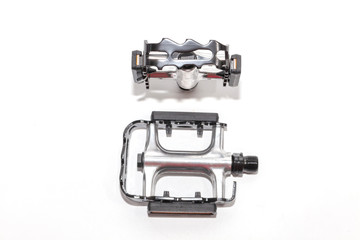 close up of bicycle pedal on white background