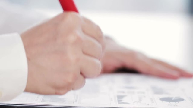 Man checking some reports or graphs, doing paperwork