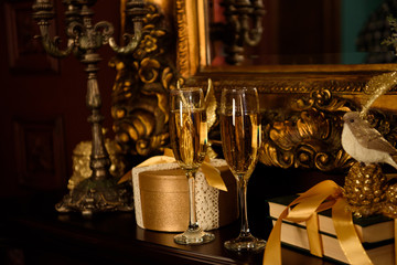 Two champagne glasses, Christmas gifts