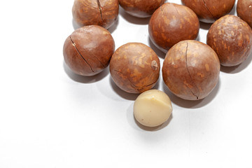 close up of organic macadamia nut on white background