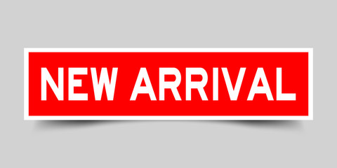 Red color sticker in word new arrival on gray background