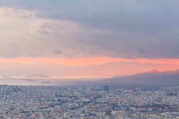 View of Athens and Piraeus from Lycabettus hill at sunset, Greece. 

