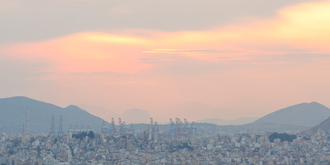 View of Athens and Piraeus from Lycabettus hill at sunset, Greece. 

