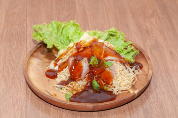 egg noodle soup with red roasted pork and sauce