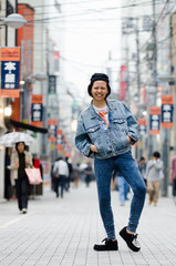 Japanese Girl poses on the street in Machida, Japan. Machida is an area located in Tokyo.