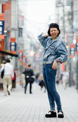 Obraz premium Japanese Girl poses on the street in Machida, Japan. Machida is an area located in Tokyo.