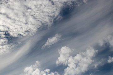 cloudscape with diagonal wispy clouds in ethereal pattern