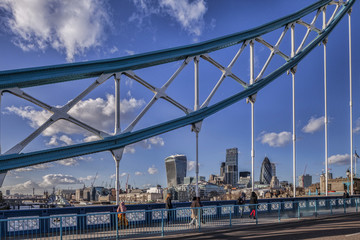 London skyline with the Walkie Talkie, the Cheese Grater and the Gherkin, seen through the superstructure of Tower Bridge.