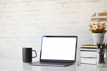 Blank screen laptop on wood table. workspace and copy space.