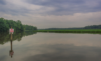 La Plata, Maryland, USA - Jun 2, 2018: Sunset on a quiet lake in a Maryland park