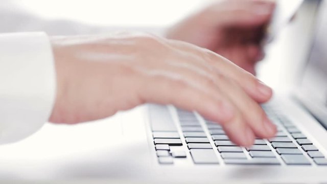 Man doing online shopping using his credit card