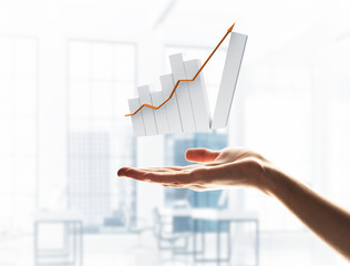 Concept of financial growth and progress by increasing arrow in palm