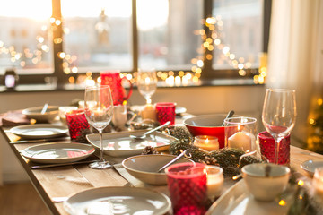 christmas, holidays and eating concept - table served for festive dinner at home