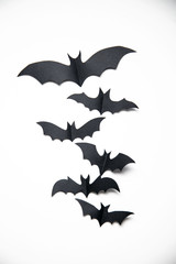 Halloween paper bat decorations on a white background.