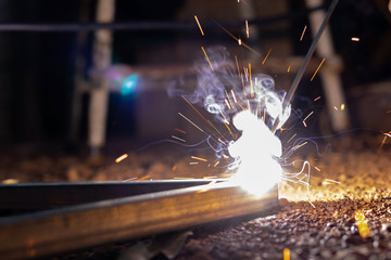 Technician focus on welding process on spark light with equipment.