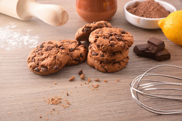 Handmade cookies with chocolate chips on wooden table elevated view