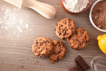 Homemade cookies with chocolate chips on wooden table top view